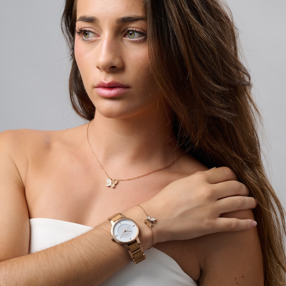 Woman wearing our Zeitholz Freiberg wooden watch and jewelry pieces.