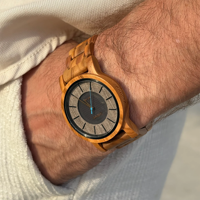 Wrist shot of the Sonnenberg solar watch with olive wood